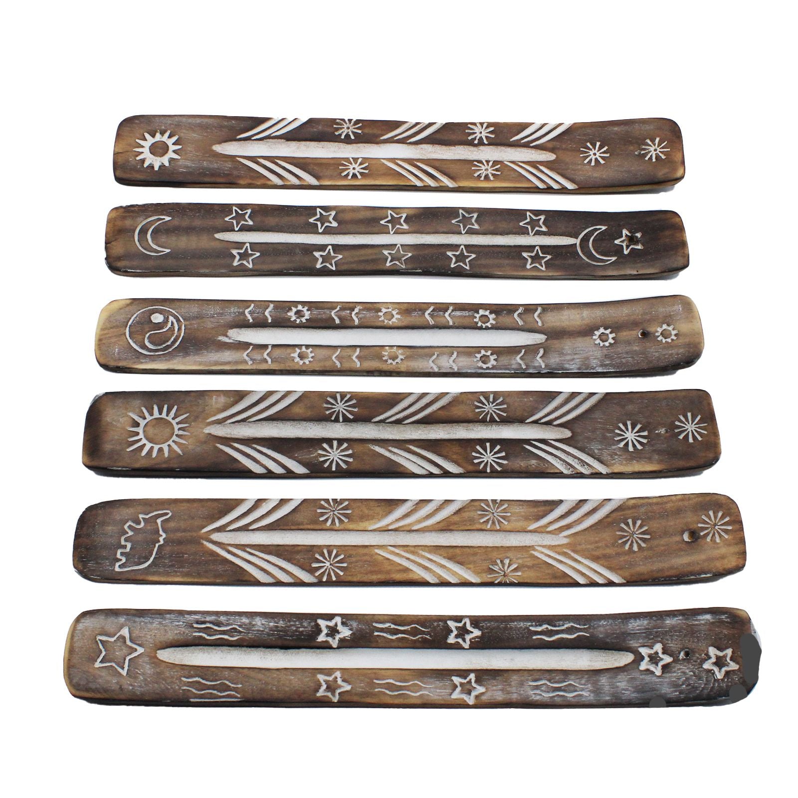 Set of six wooden incense sticks with engraved designs on a white background