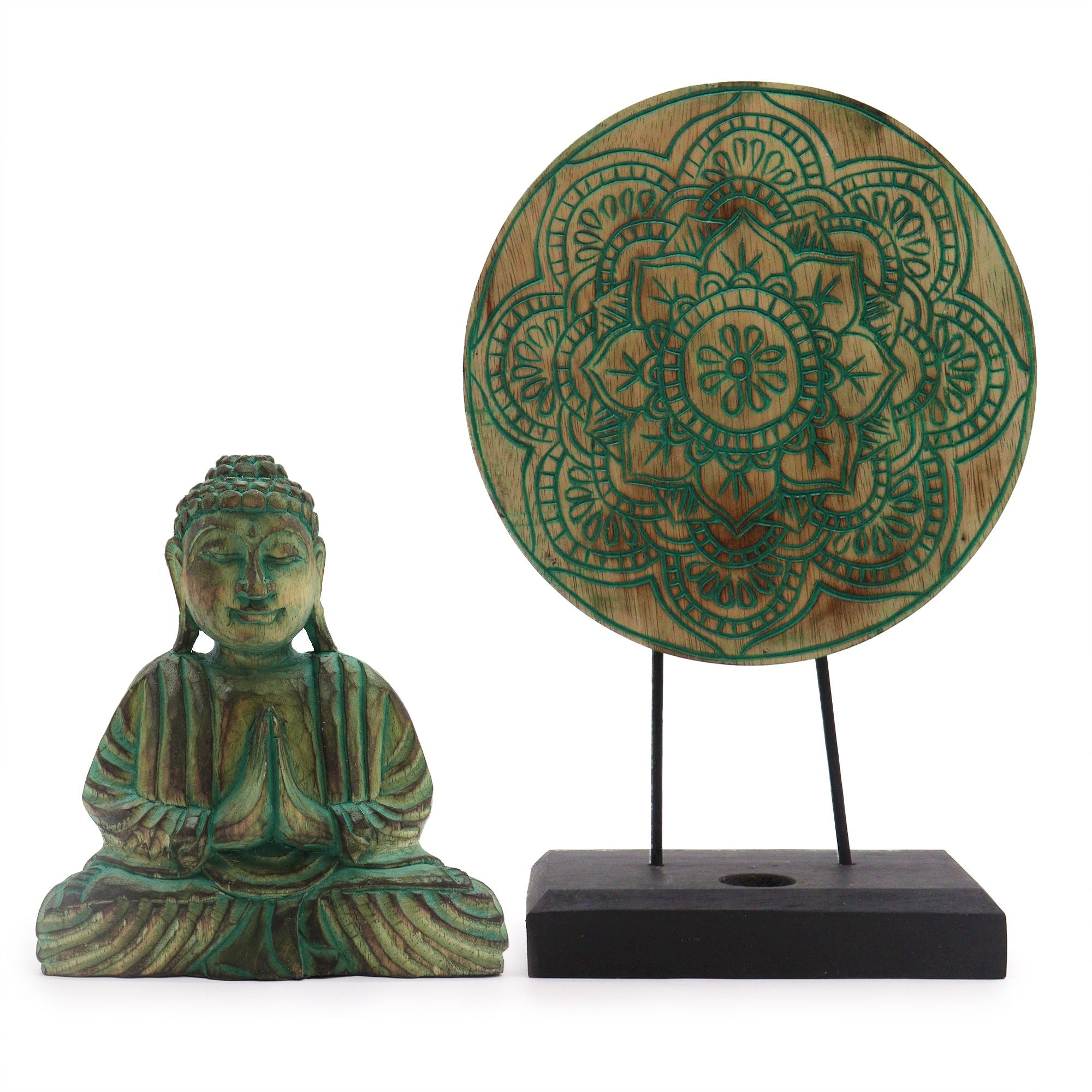 Green Buddha statue and decorative mandala on a stand against a white background