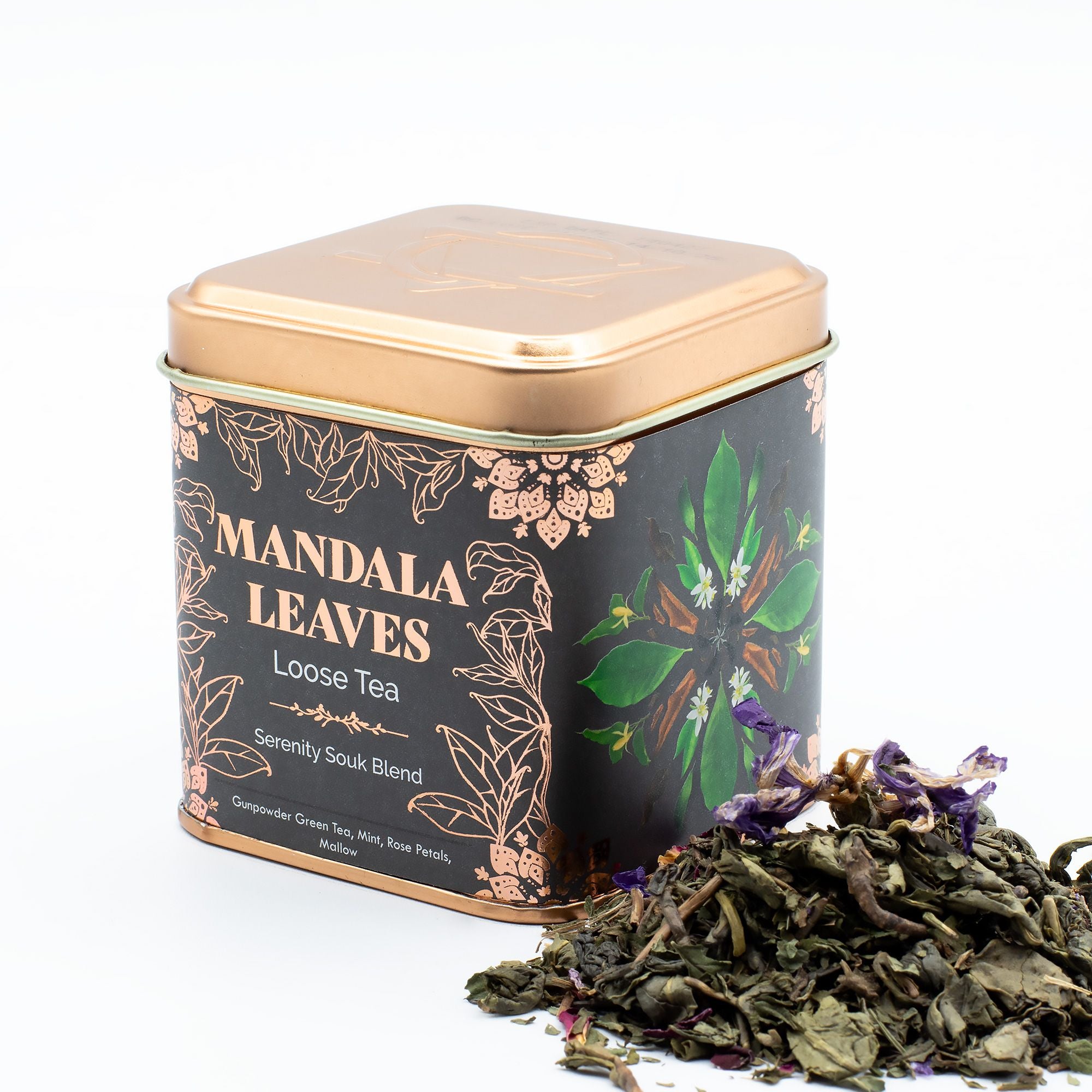 Tea canister labeled 'Mandala Leaves' with loose tea leaves on a white background