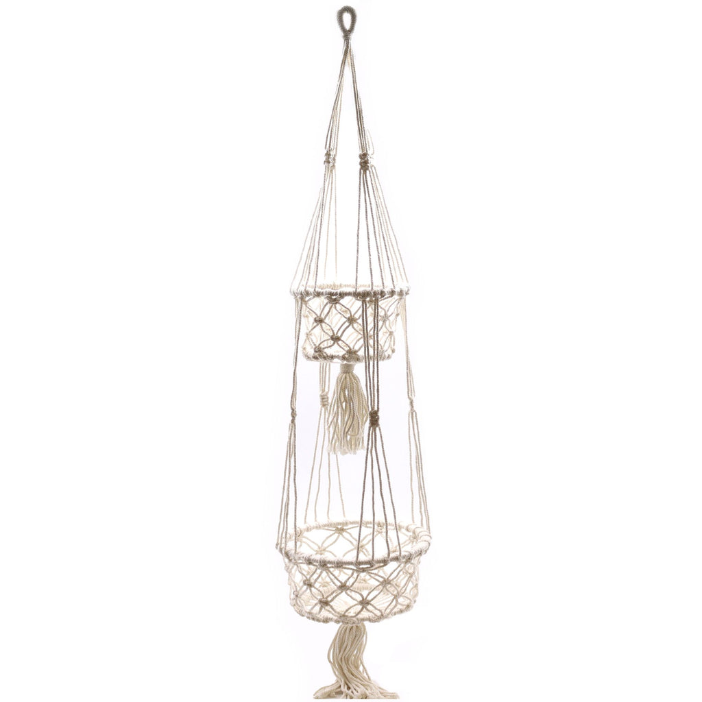 Macrame plant hanger with tassels on a white background