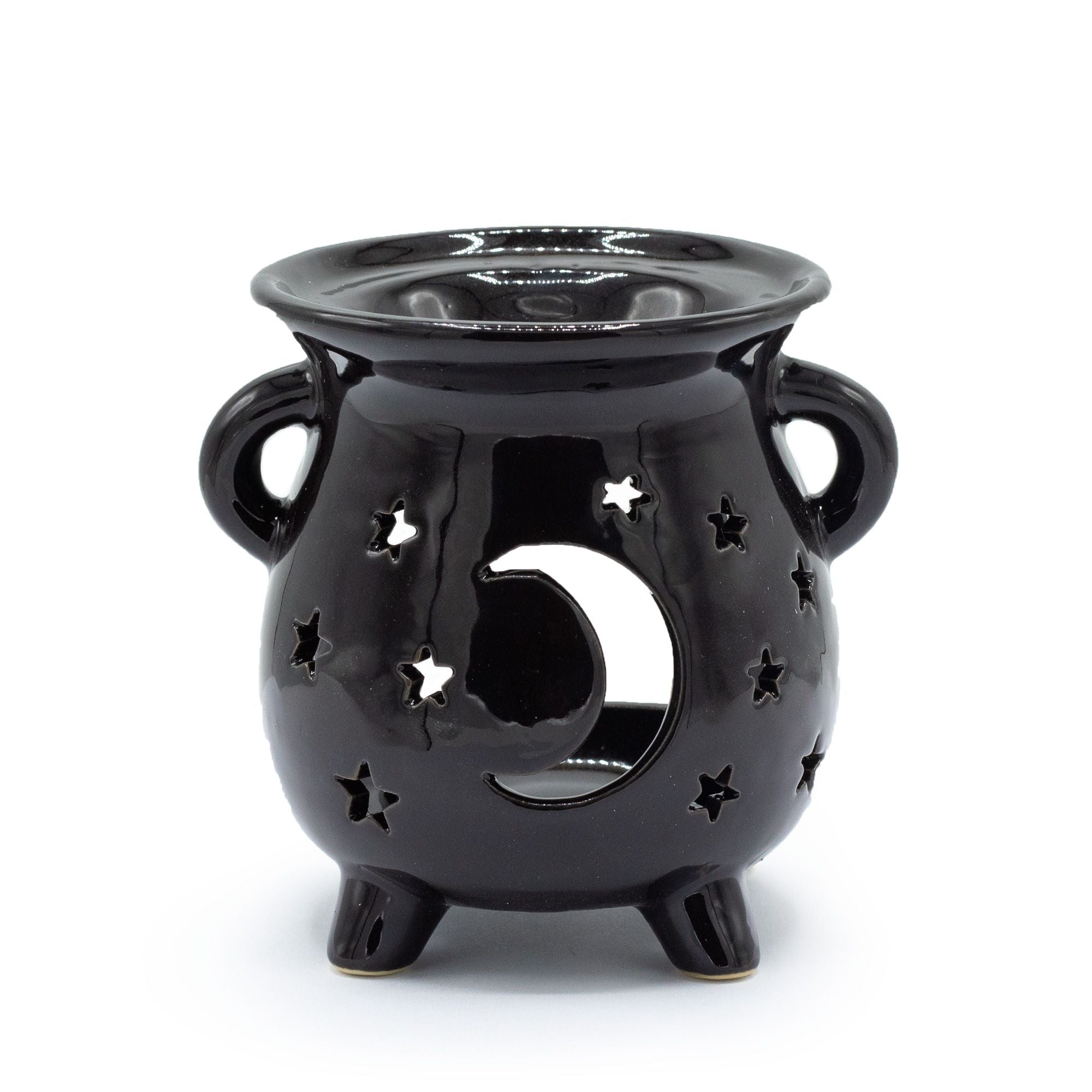 Black ceramic oil burner with star and moon design on a white background