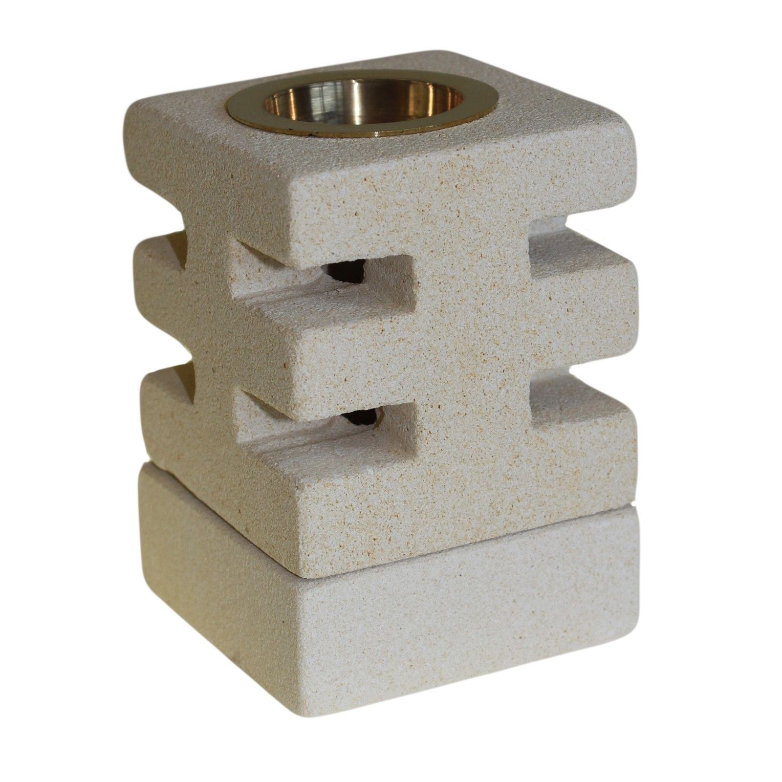 Cement-like square candle holder with a brass center on a white background