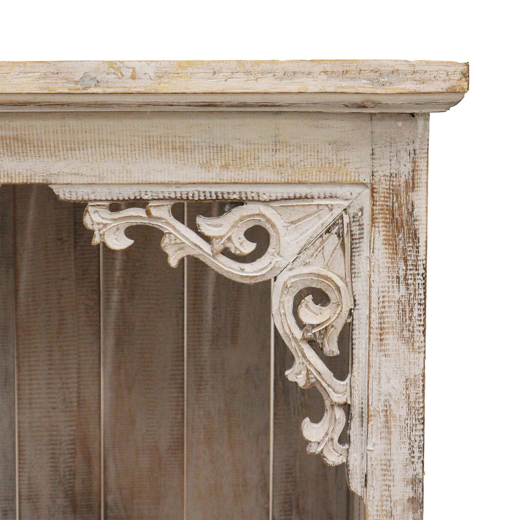 Wooden fireplace mantel with decorative corbels on a white background