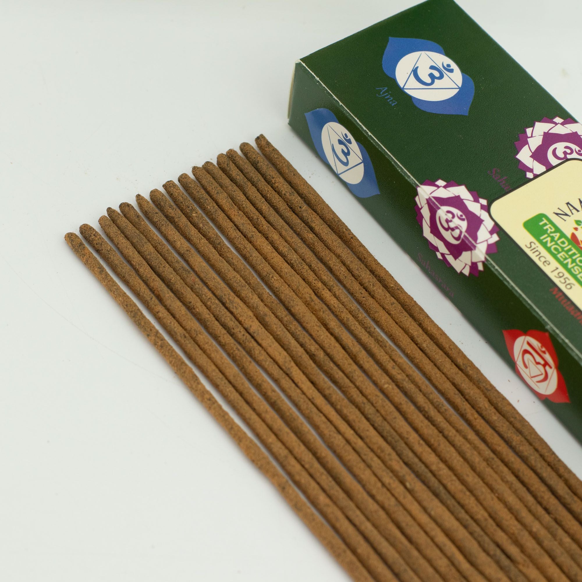 Incense sticks with a green box on a white background