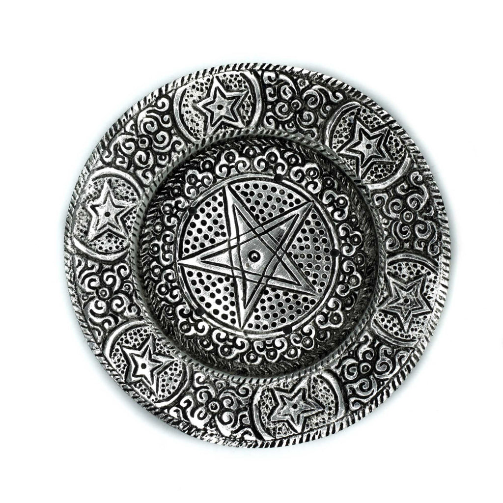 Decorative metal plate with star design on a white background