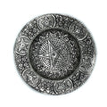 Decorative metal plate with star design on a white background