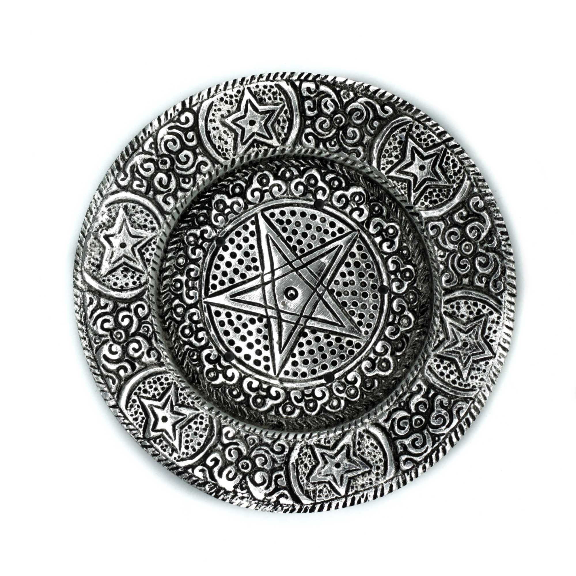 Decorative metal plate with star design on a white background