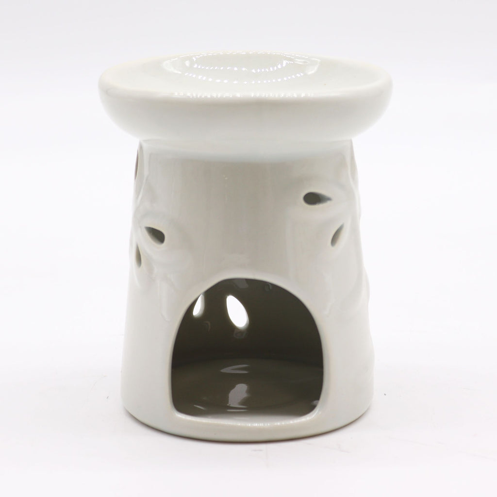White ceramic oil burner with a white background