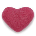 Heart-shaped pink sponge on a white background