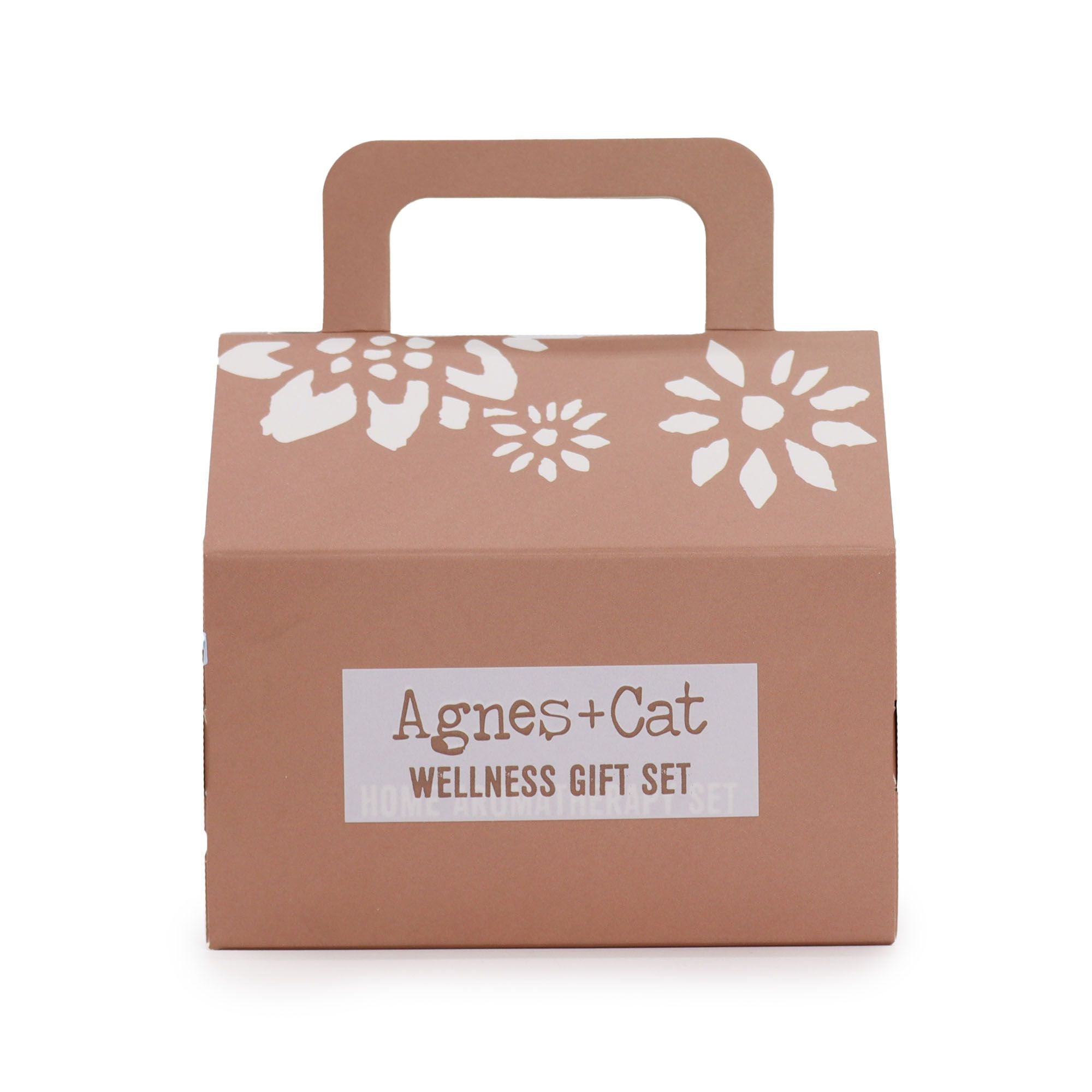 Brown gift box with floral design and 'Agnes + Cat Wellness Gift Set' label on a white background
