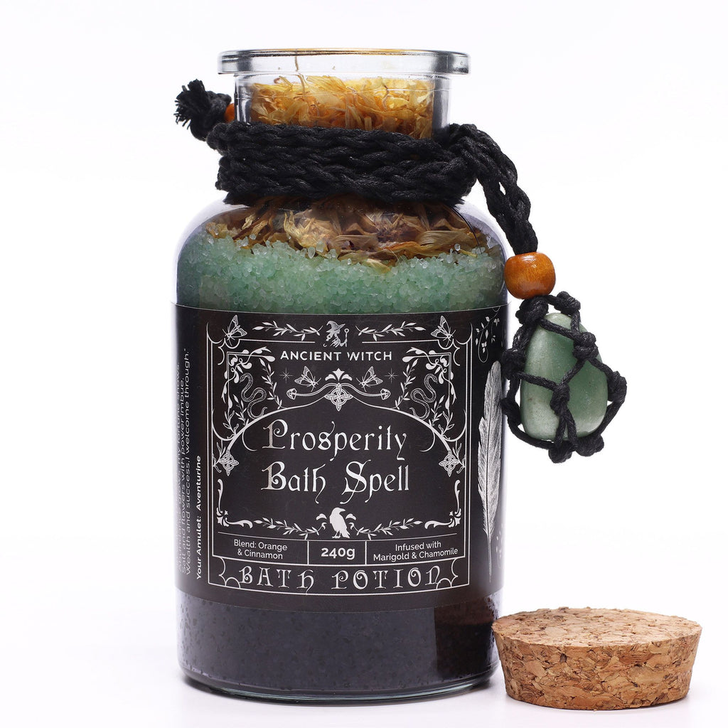 Bath potion labeled 'Prosperity Bath Spell' with decorative elements on a white background