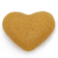 Heart-shaped sponge on a white background