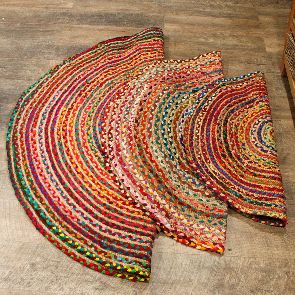 Multicolored braided rug on a wooden floor