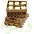Stack of cardboard boxes with heart-shaped objects and additional heart-shaped objects on a white background