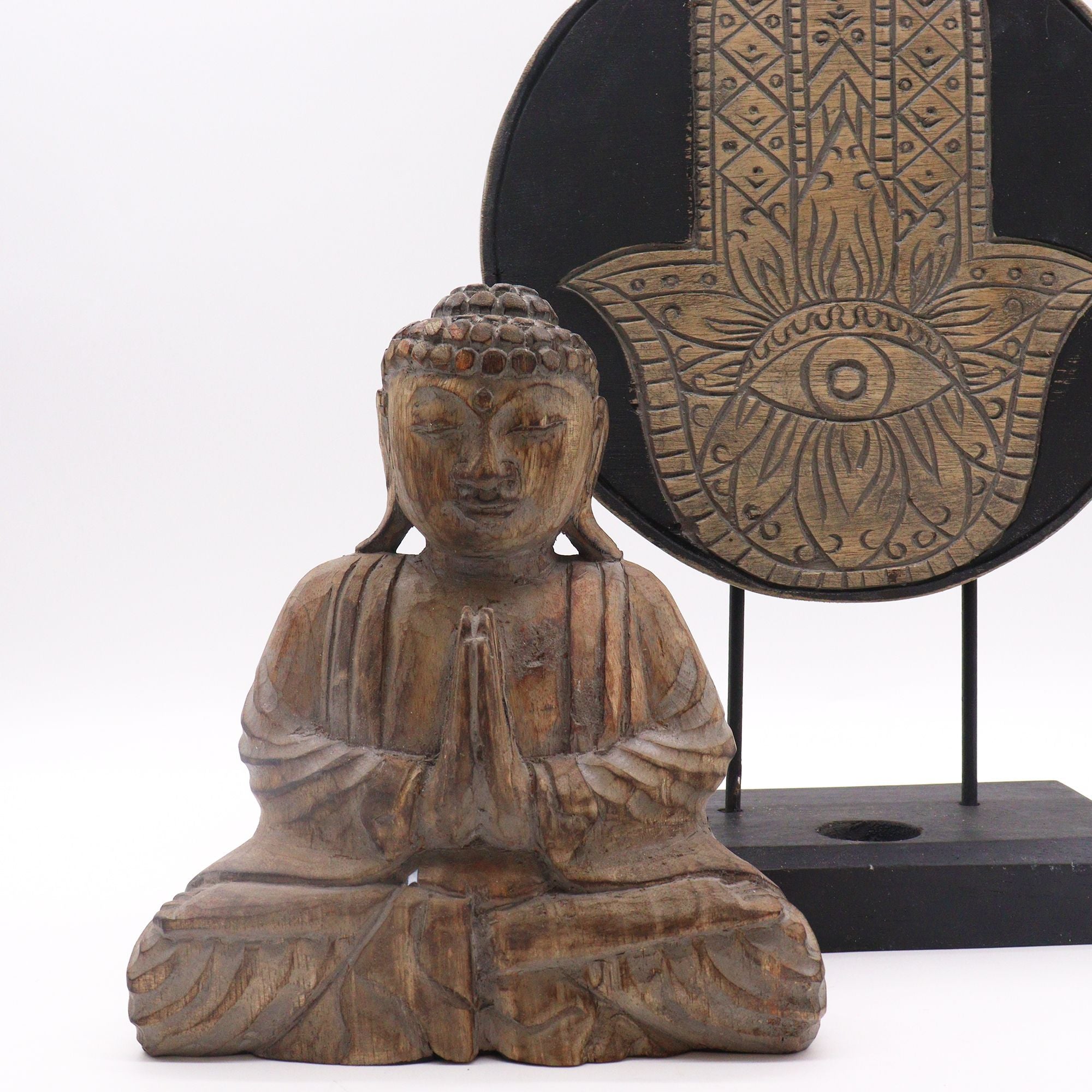 Wooden Buddha statue with decorative background
