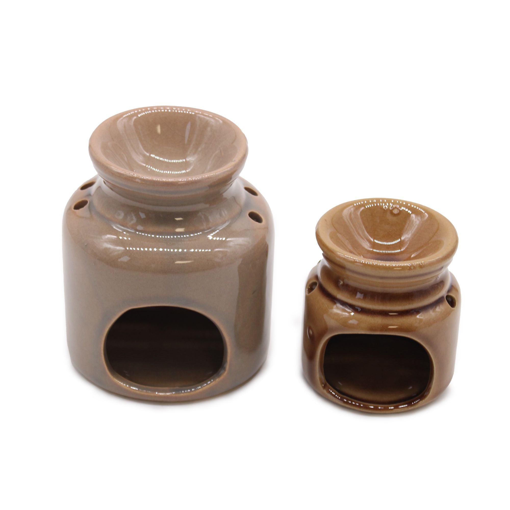 Two brown ceramic oil burners on a white background