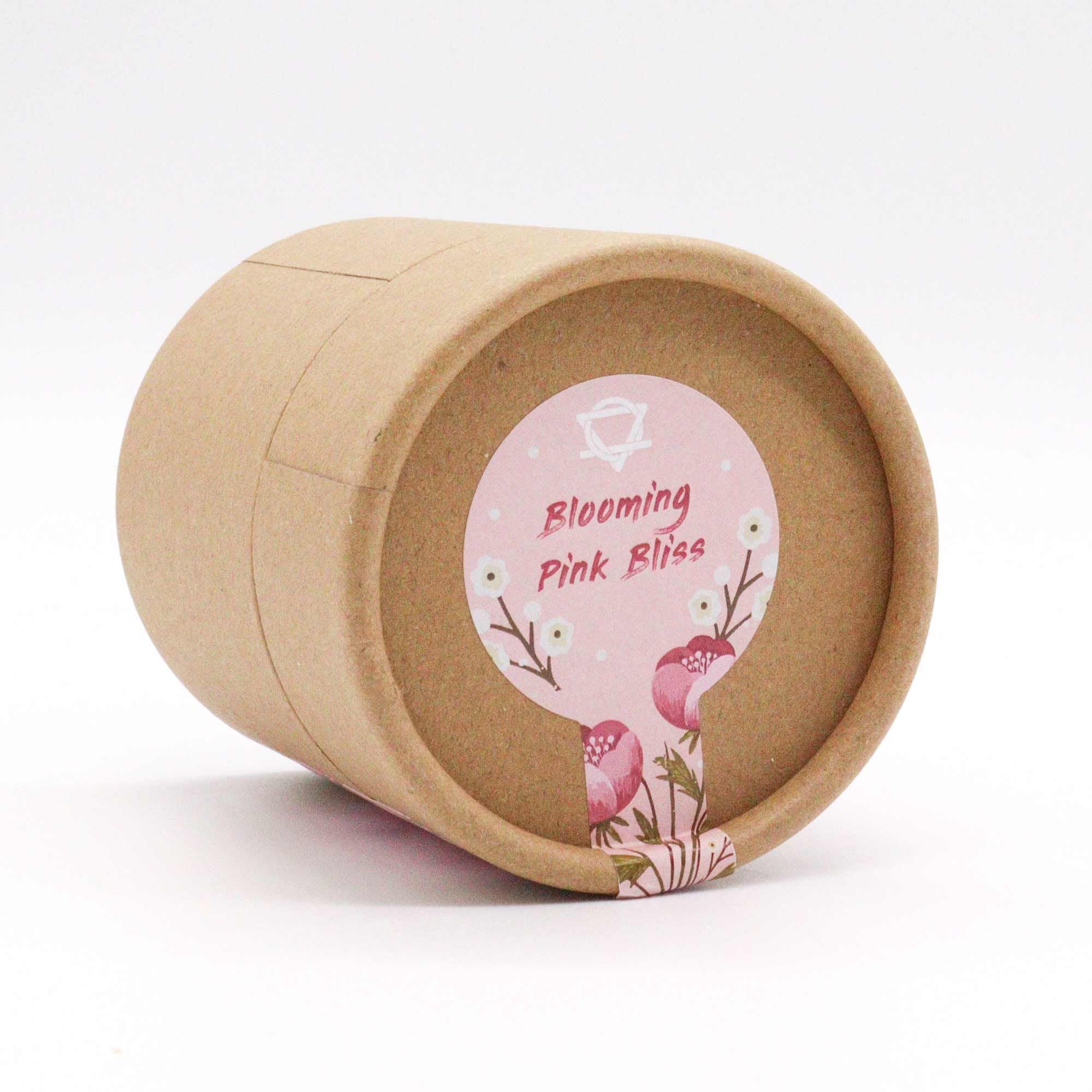 Brown paper cup with a pink label on a white background