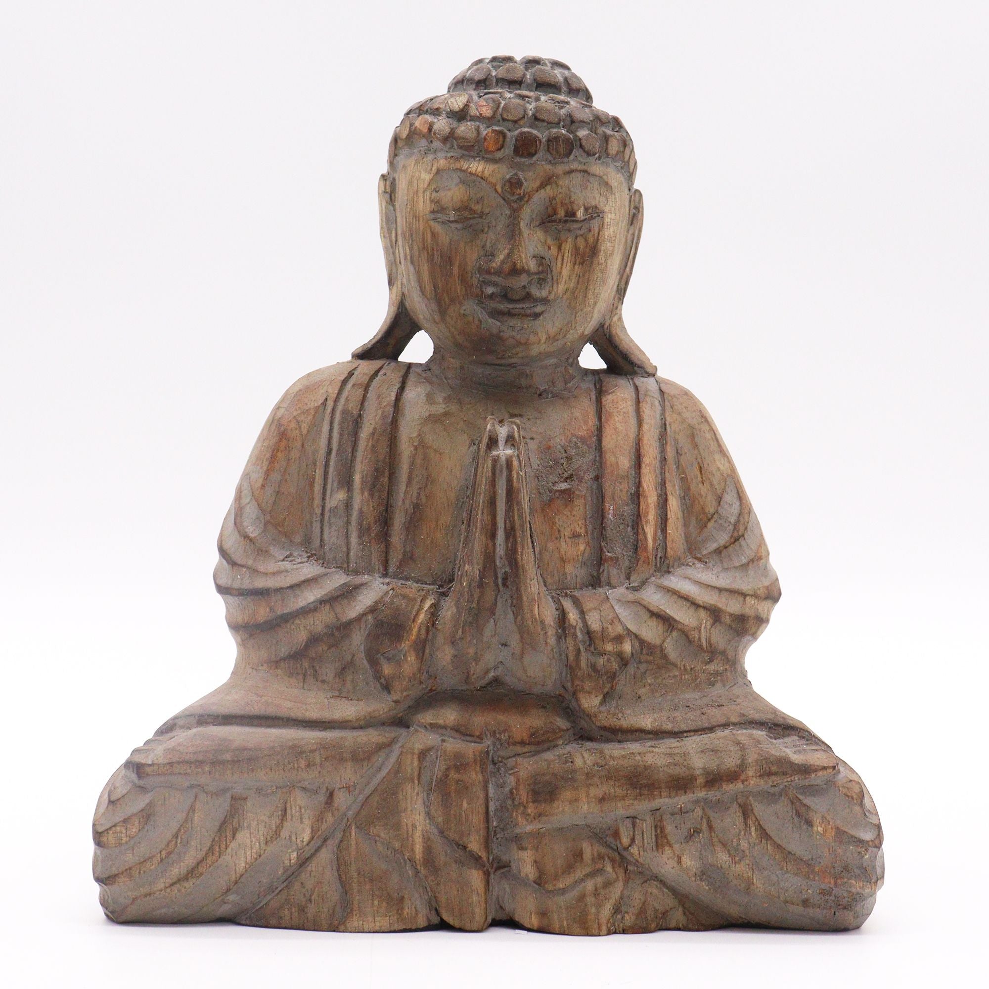 Wooden Buddha statue with hands in prayer position on a white background