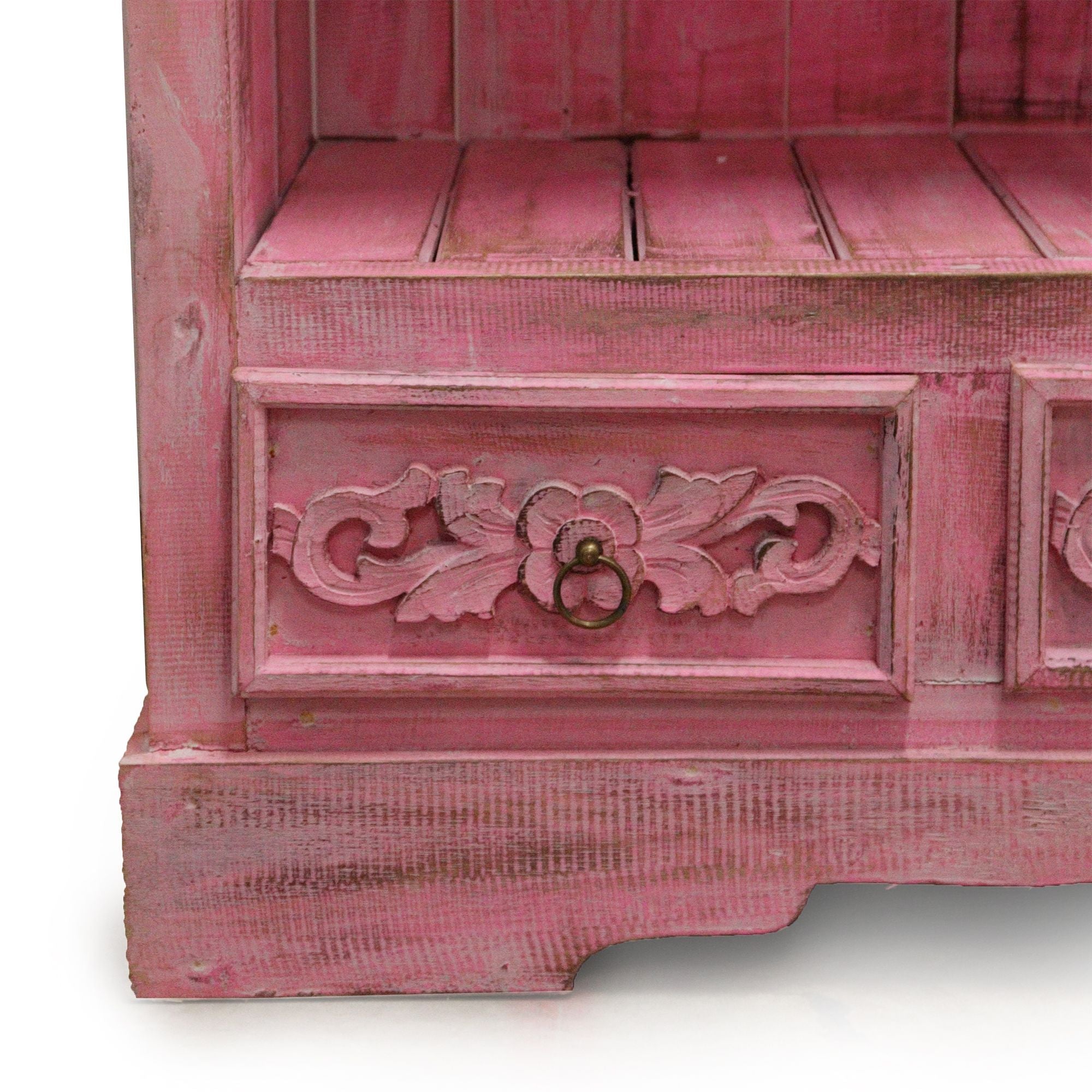 Pink wooden cabinet with decorative carvings on a white background