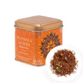 Orange tea tin labeled 'Mandala Leaves Rooibos Tea' with a small inset showing tea leaves.
