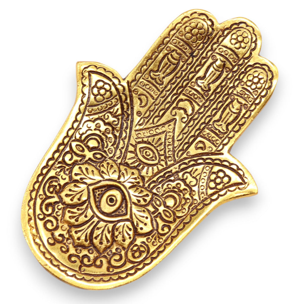 Decorative gold Hamsa hand on a white background