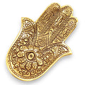 Decorative gold Hamsa hand on a white background
