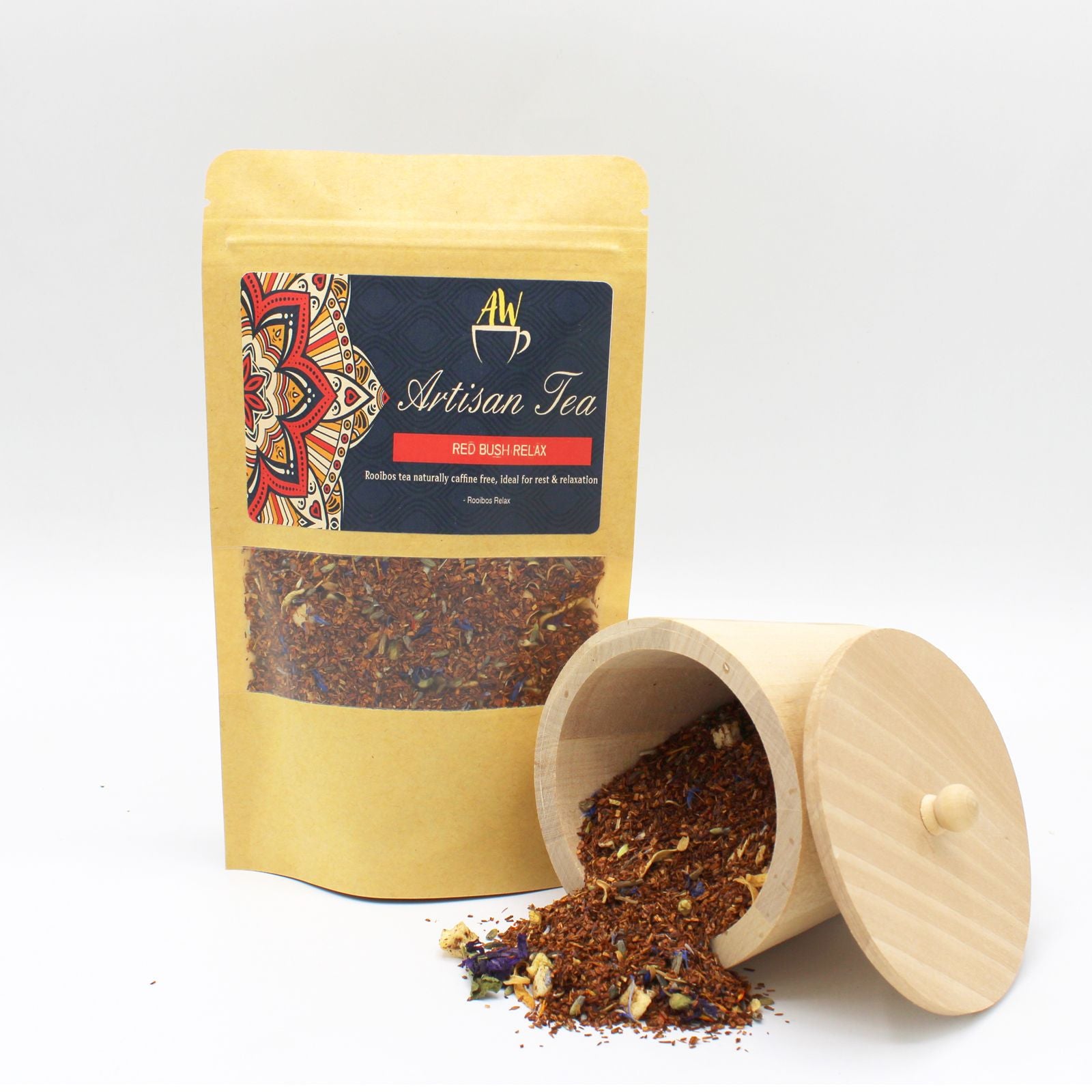Artisan Tea package with loose tea spilling out of a wooden container on a white background