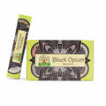 Box and stick of Black Opium masala incense on a white background