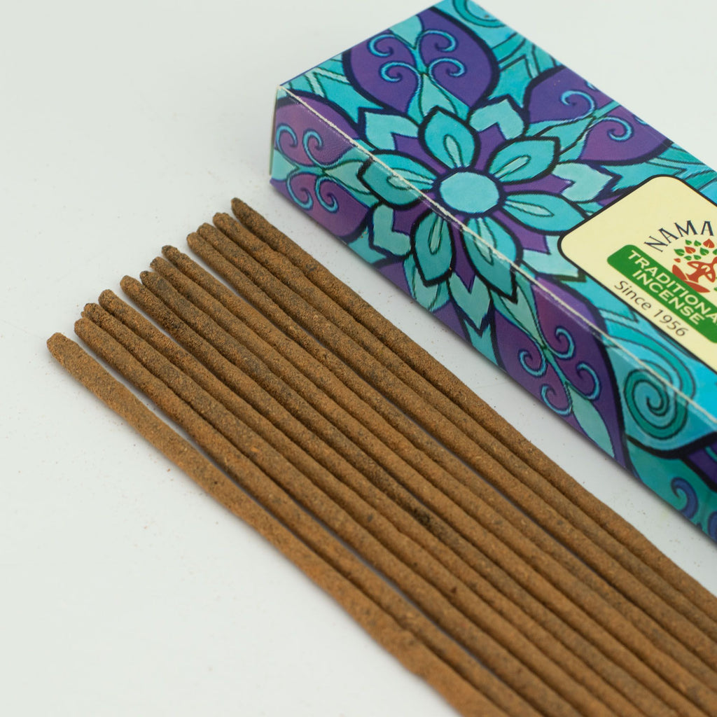 Incense sticks with a colorful box on a white background