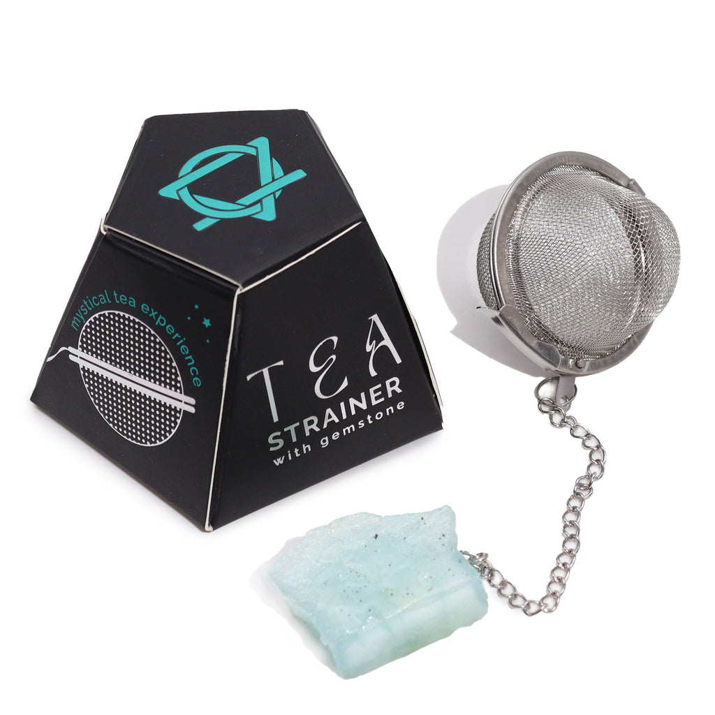 Tea strainer with gemstone and packaging on a white background
