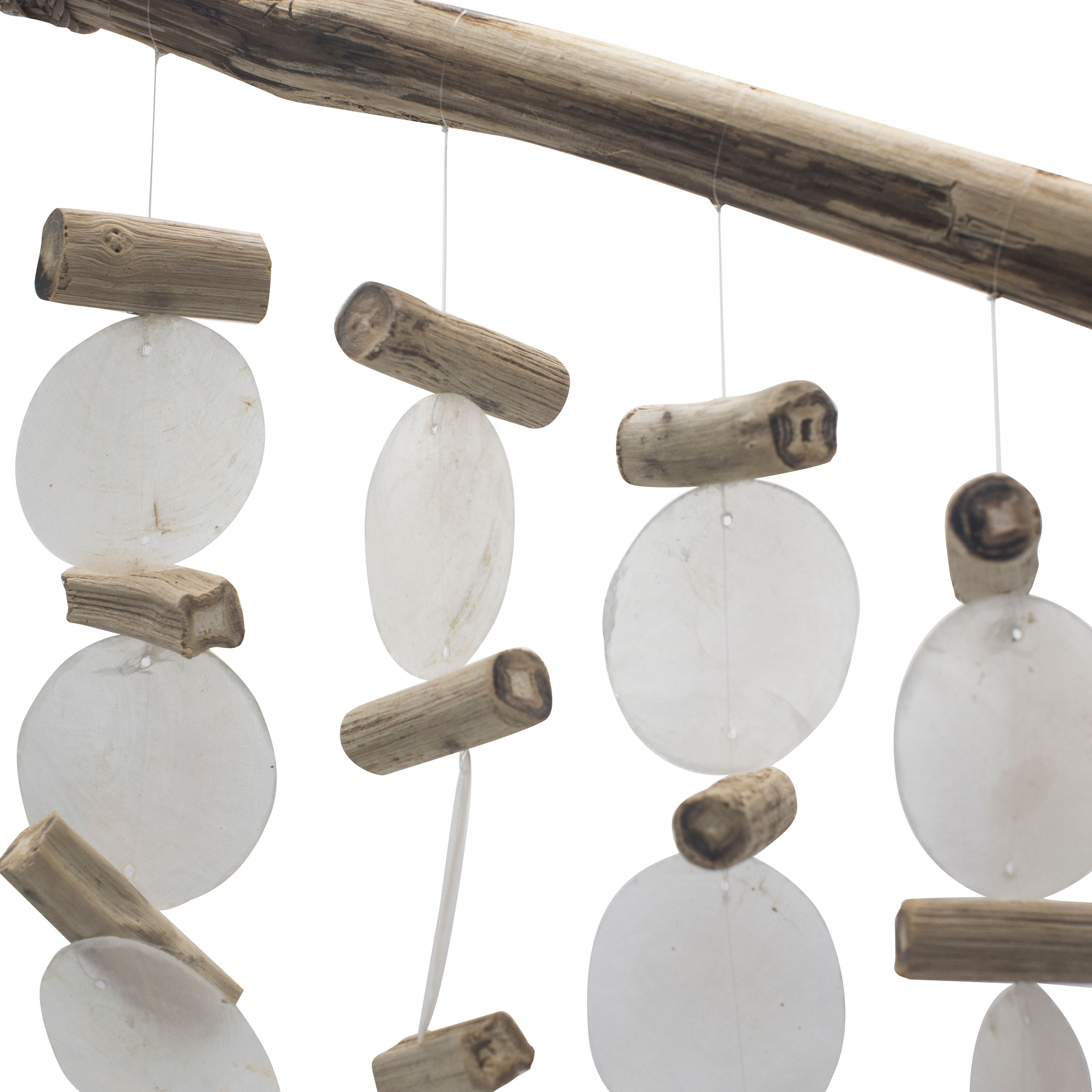 Decorative hanging with white circular beads and wooden sticks on a white background