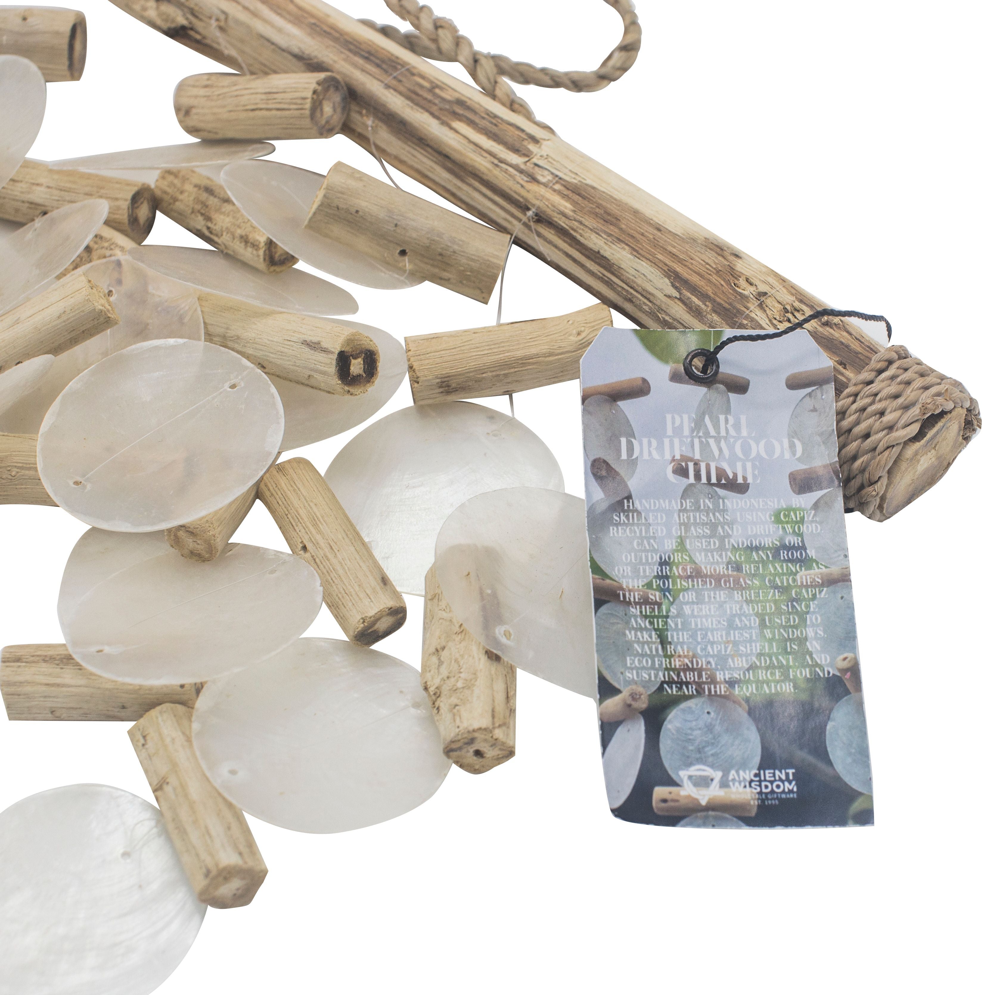 Driftwood and glass stones with a product tag on a white background