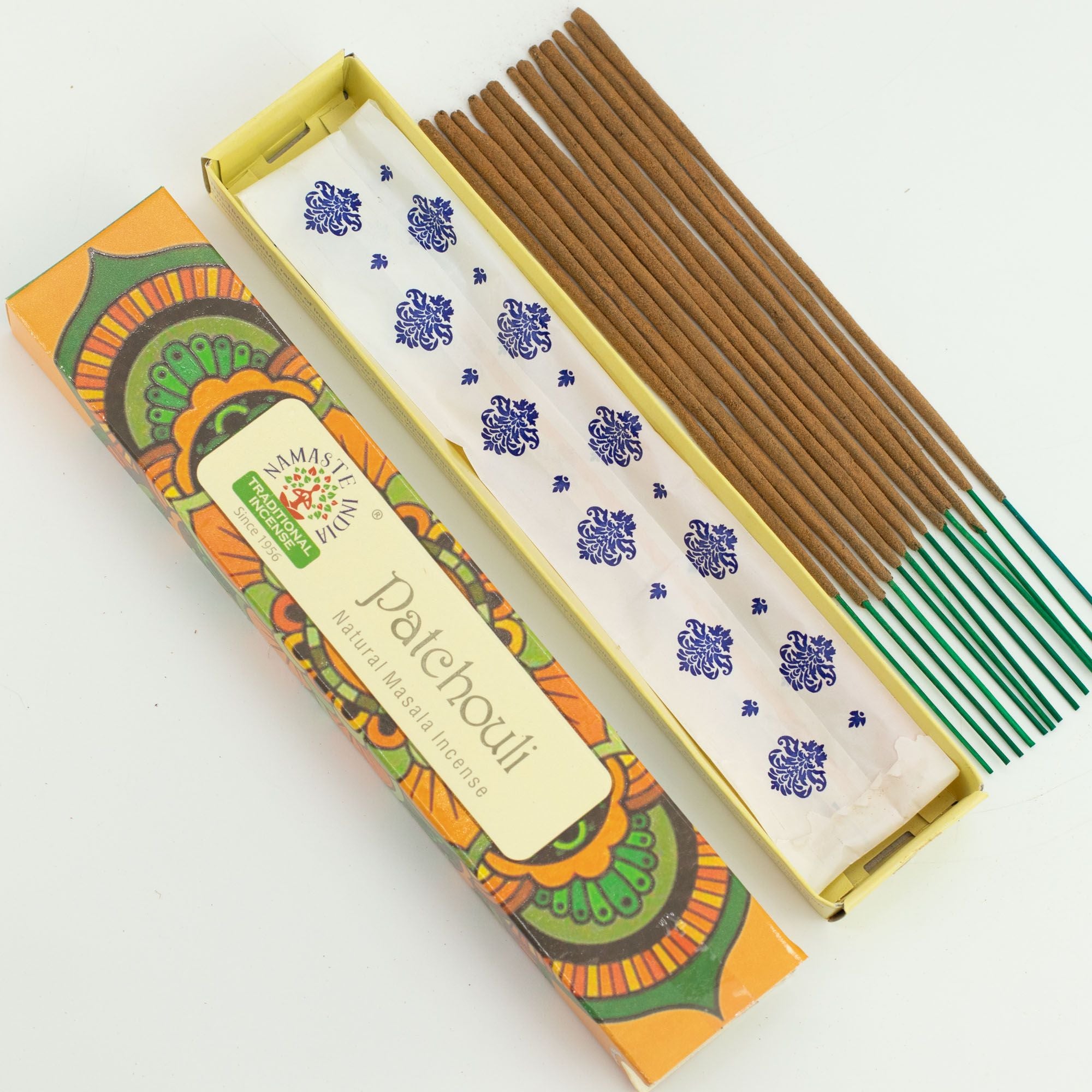 Incense sticks with a colorful box on a white background