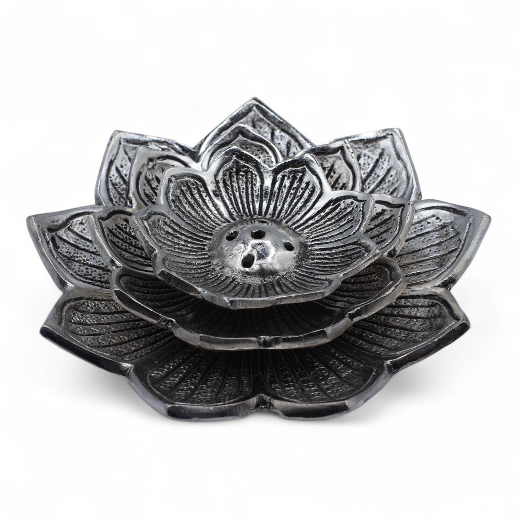 Decorative metal lotus flower on a white background