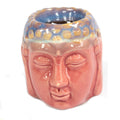 Ceramic face-shaped container with a blue and yellow pattern on a white background