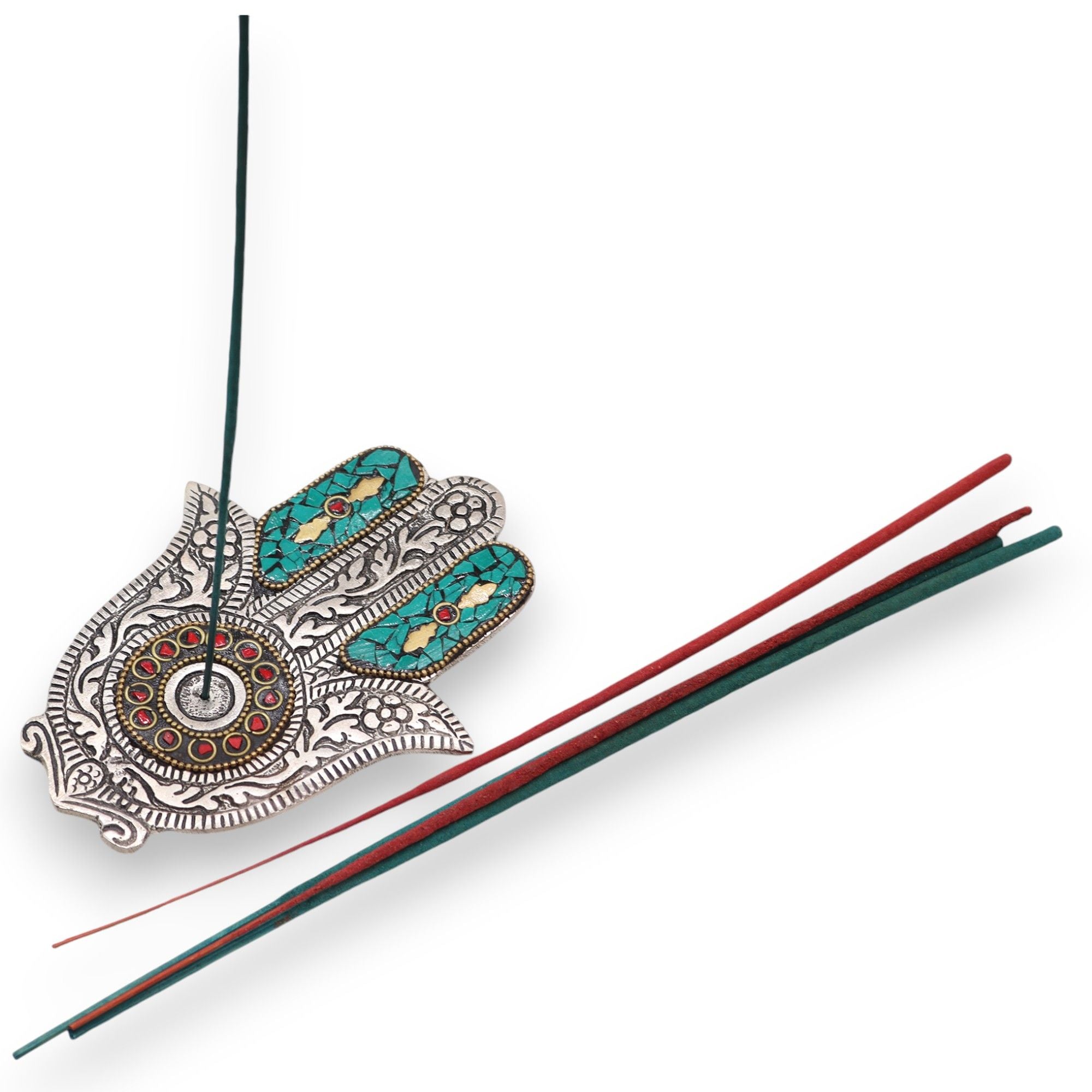 Decorative incense holder with intricate designs and two incense sticks on a white background