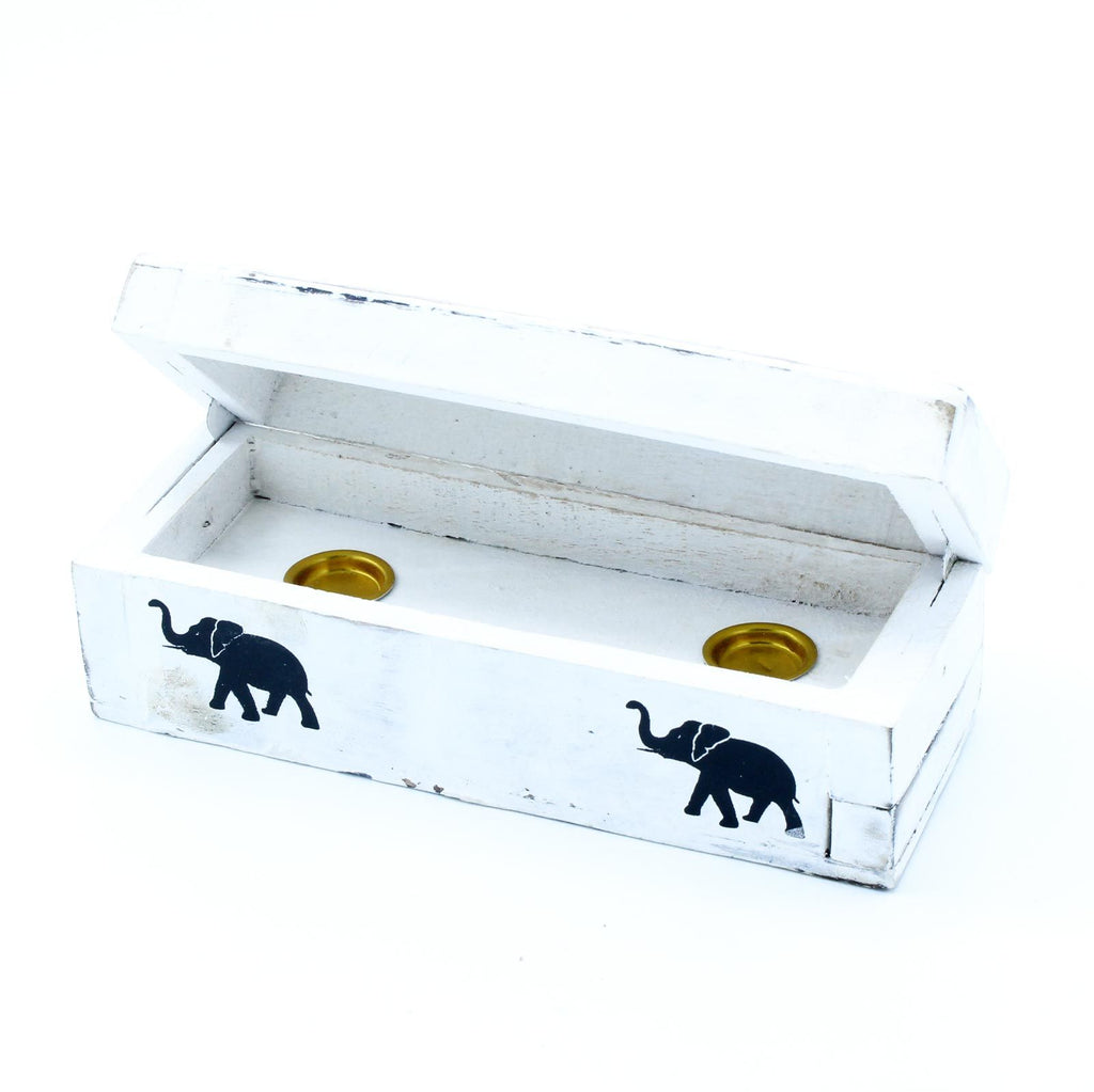 White wooden box with elephant designs on a white background