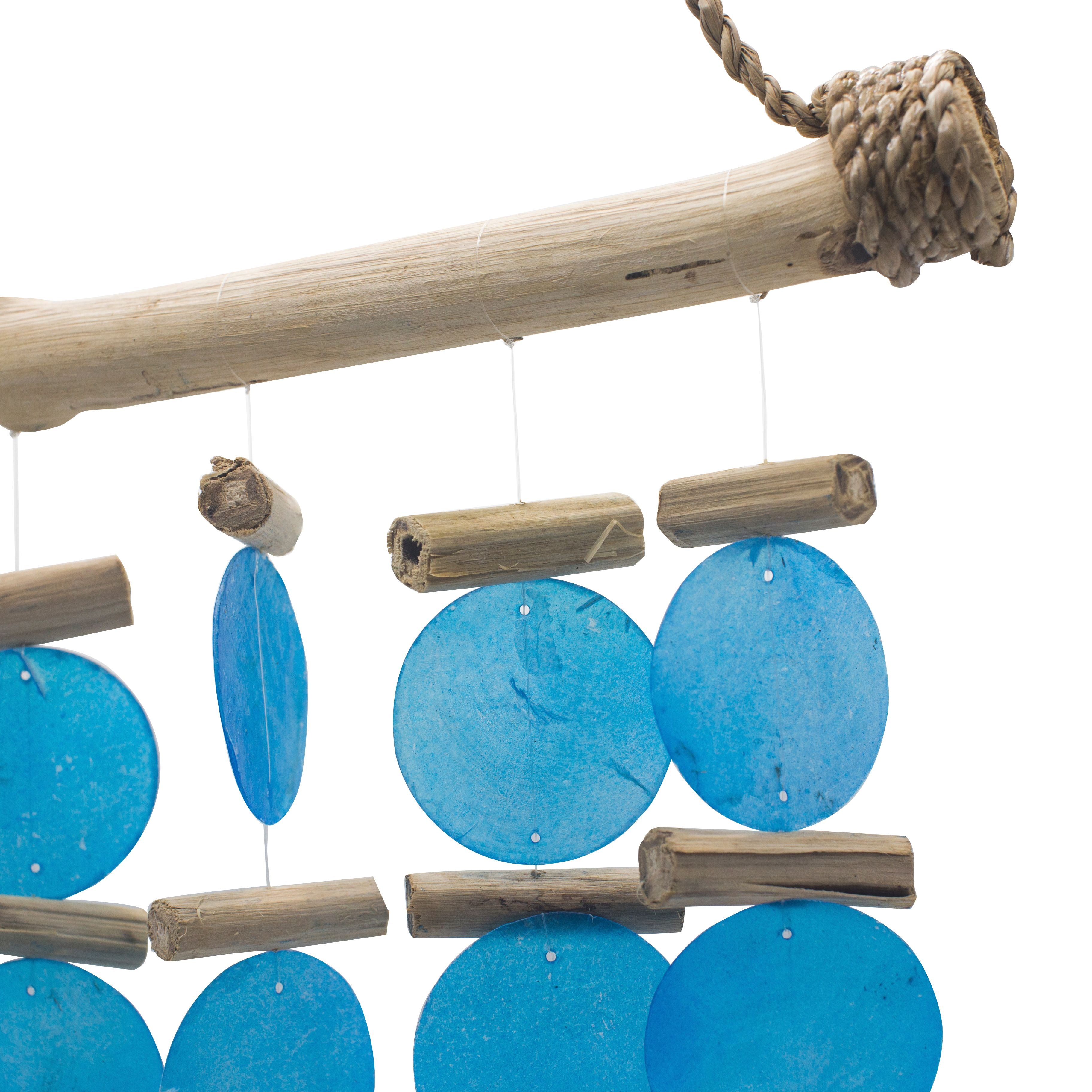 Decorative hanging mobile with blue circular discs and wooden sticks on a white background