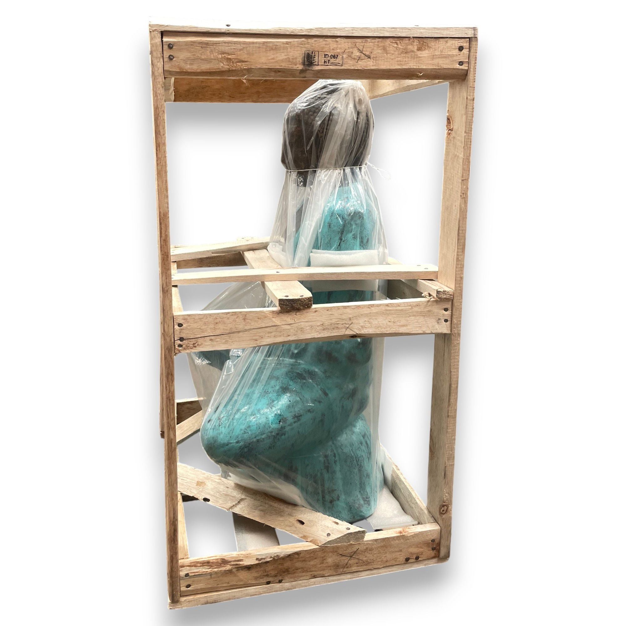 Wooden frame with teal sculpture inside on a white background