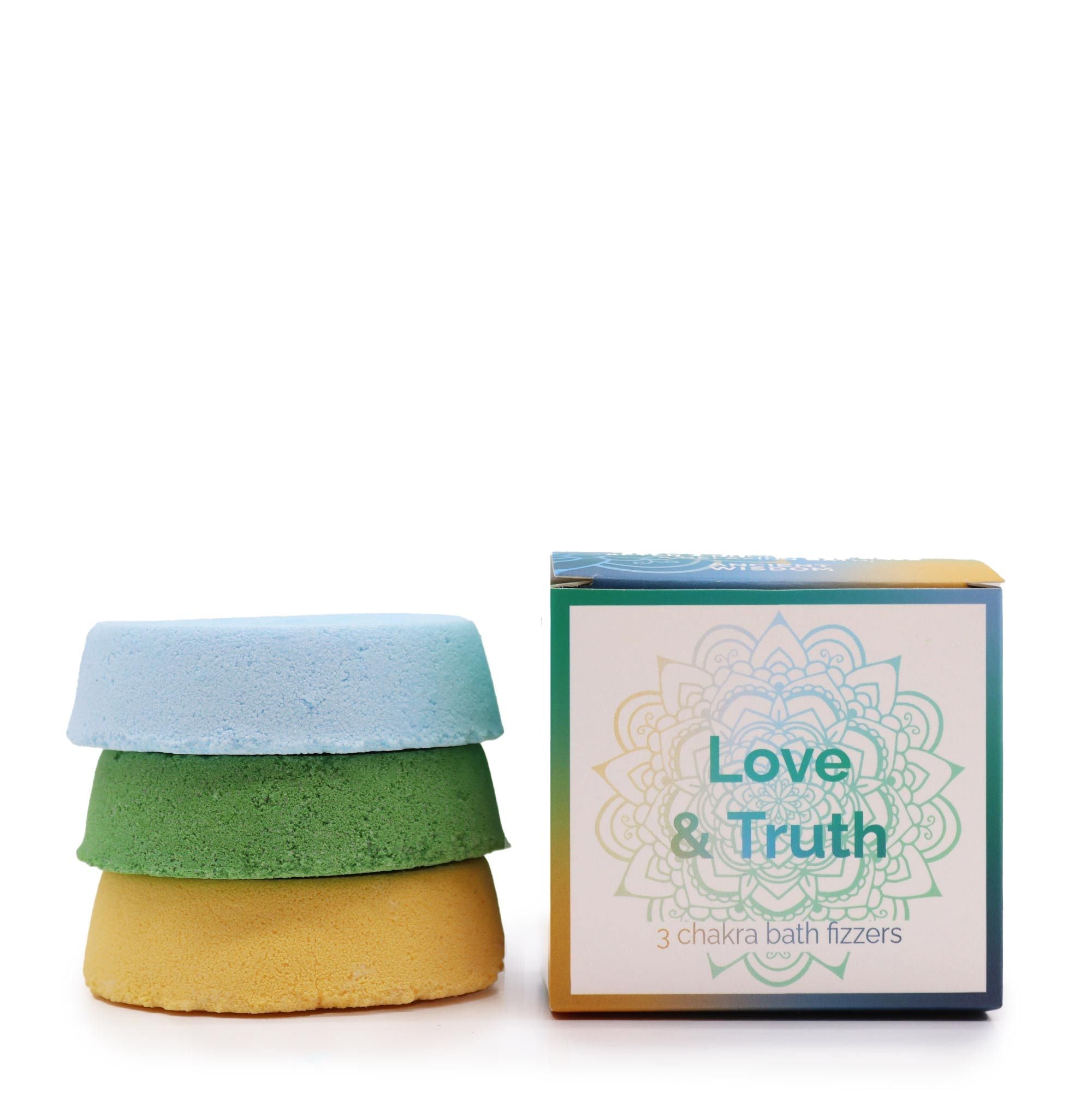 Three chakra bath fizzers with a box labeled 'Love & Truth' on a white background