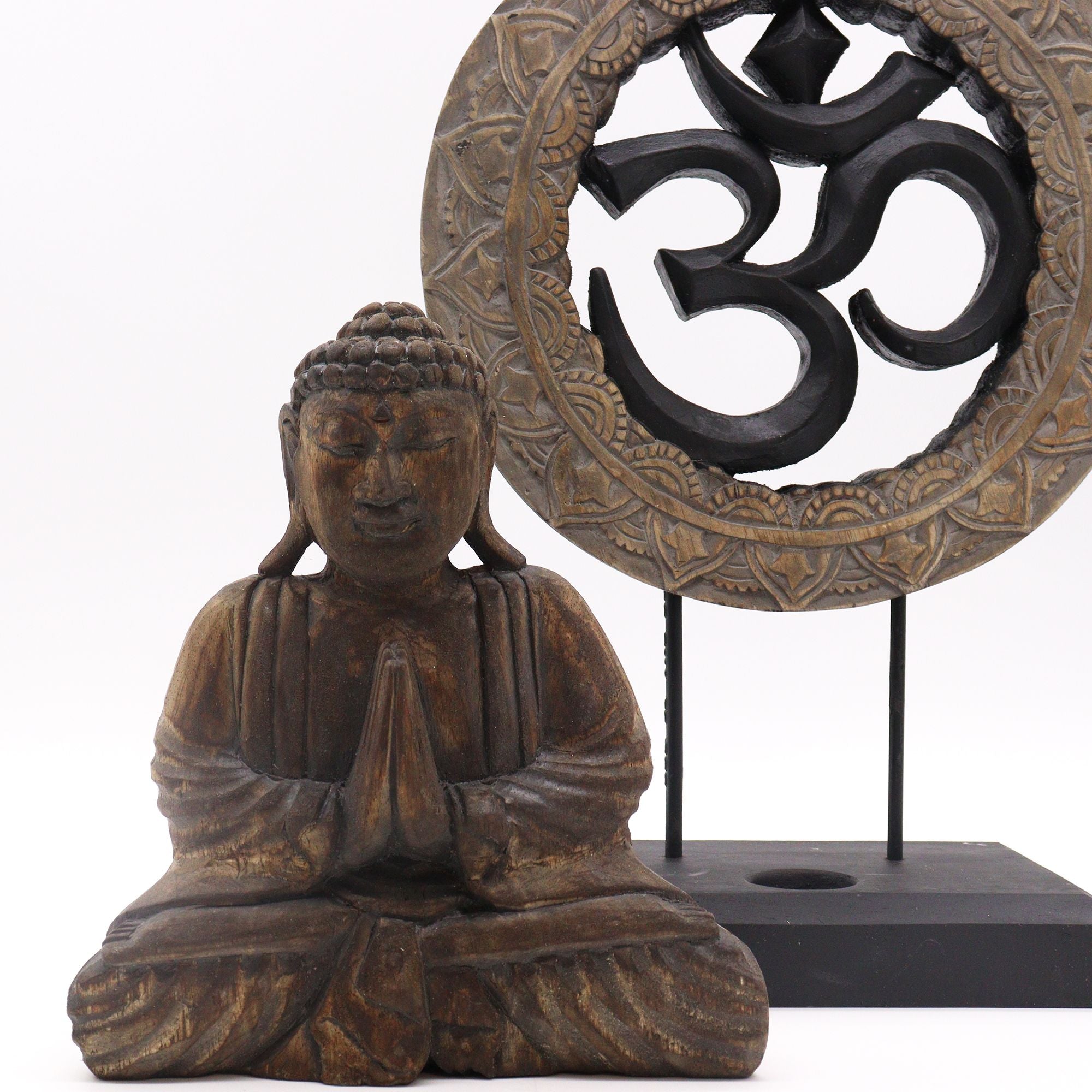 Buddha statue and Om symbol on a white background