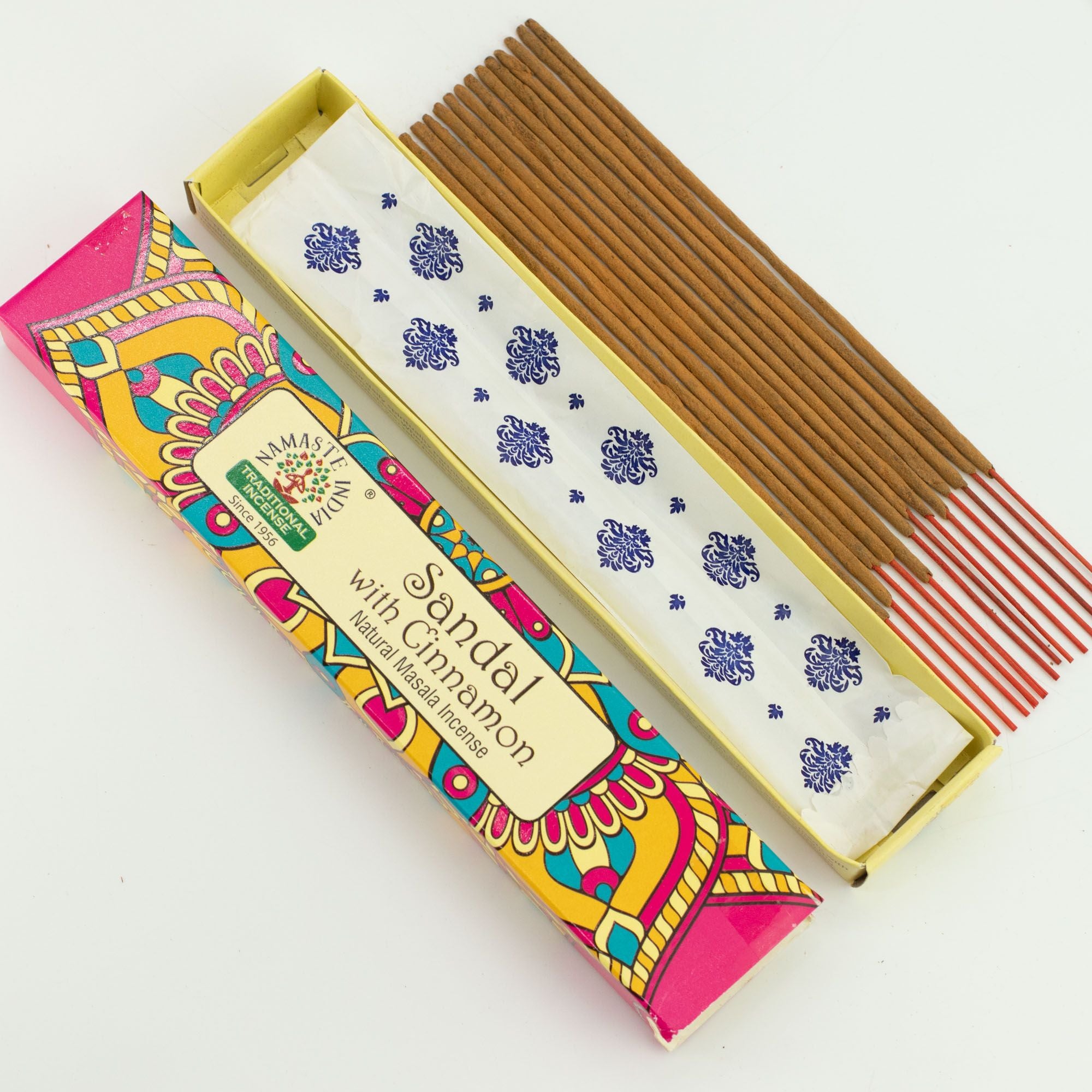 Incense sticks with a colorful box on a white background