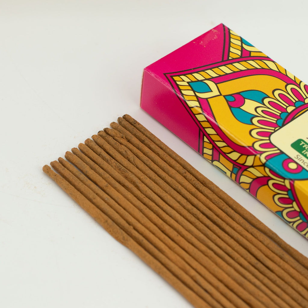 Incense sticks with a colorful box on a white background