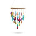 Colorful leaf-shaped hanging mobile on a white background