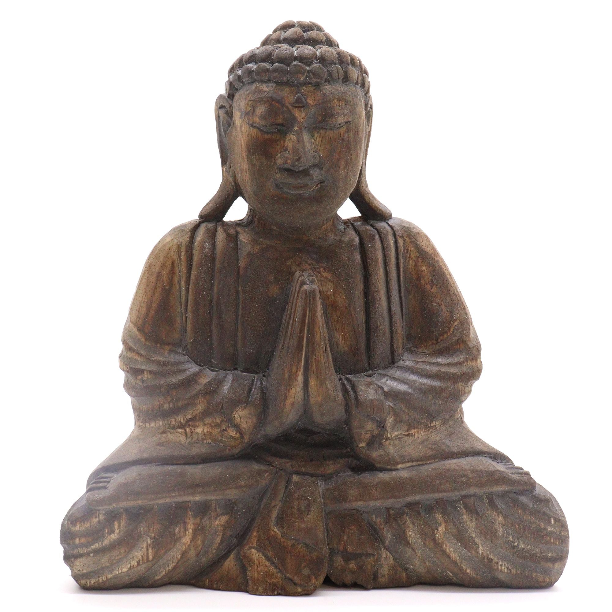 Wooden Buddha statue with hands in prayer position on a white background