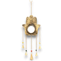 Decorative hanging item with a hand design and dangling elements on a white background