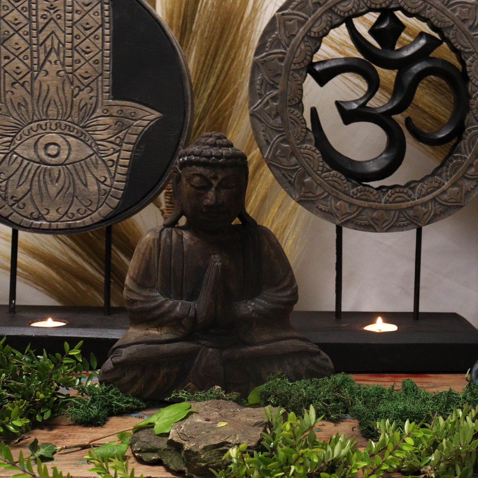 Buddha statue with decorative plates featuring symbols in a serene setting
