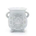 White ceramic owl-shaped lantern with cut-out design on a white background