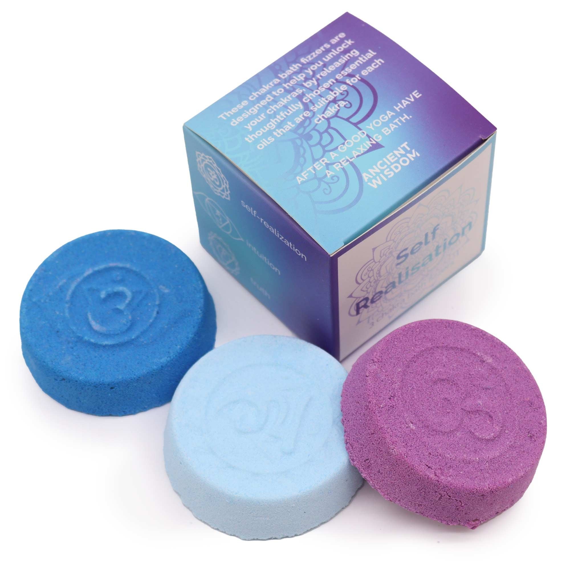 Three bath bombs in blue, purple, and pink with a box labeled 'Self Reassurance' on a white background.