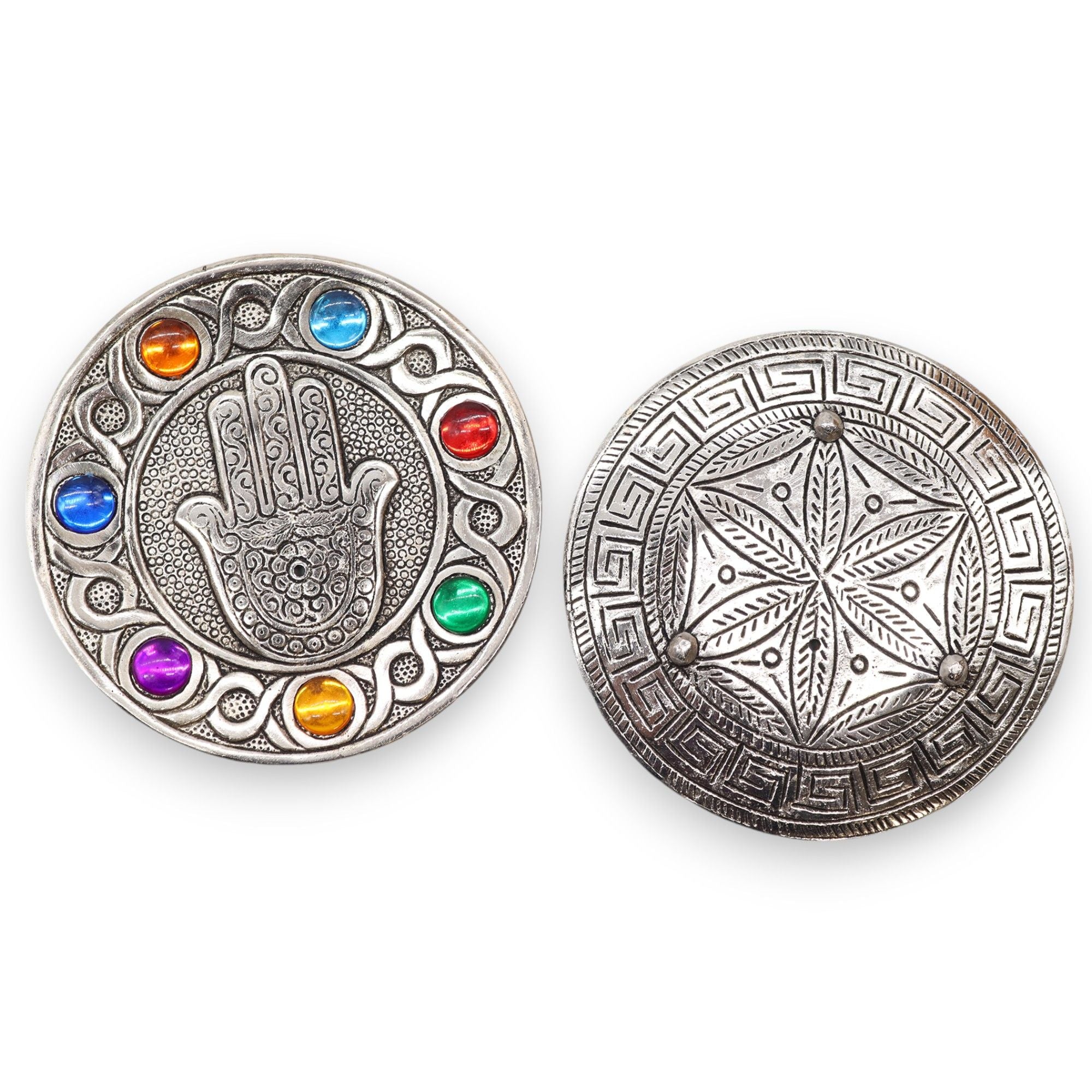 Two silver circular medallions with colorful gemstones and intricate designs on a white background.